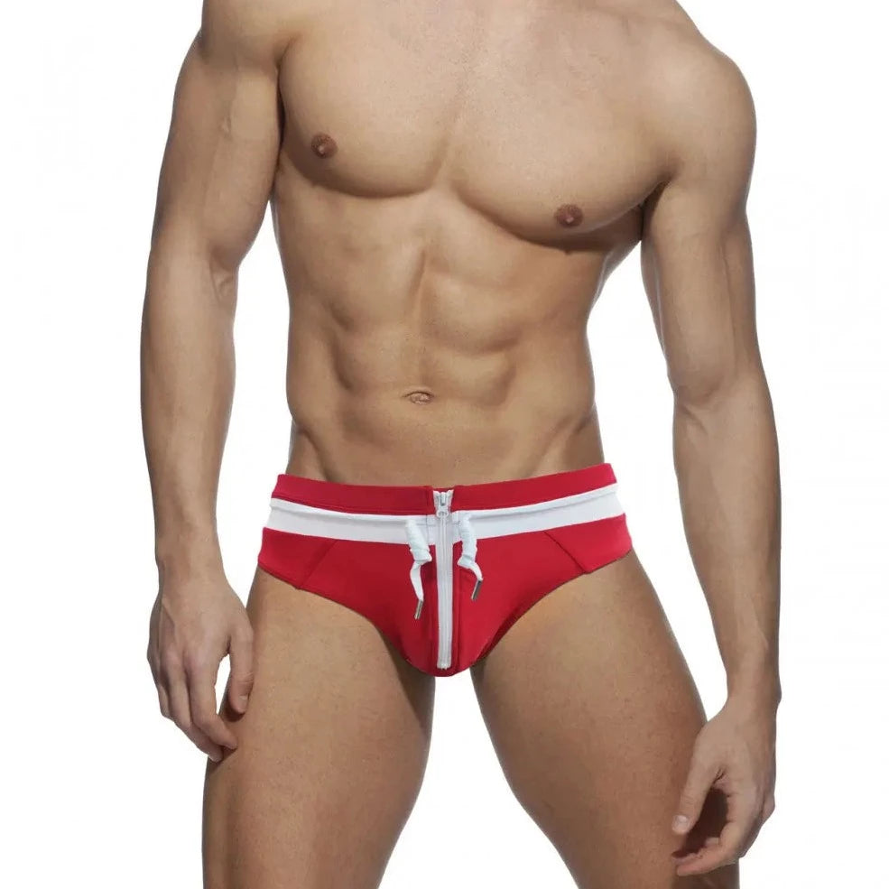 a sexy gay man in Red and White Men's Bowtie Zippered Swim Briefs - pridevoyageshop.com - gay men’s underwear and swimwear