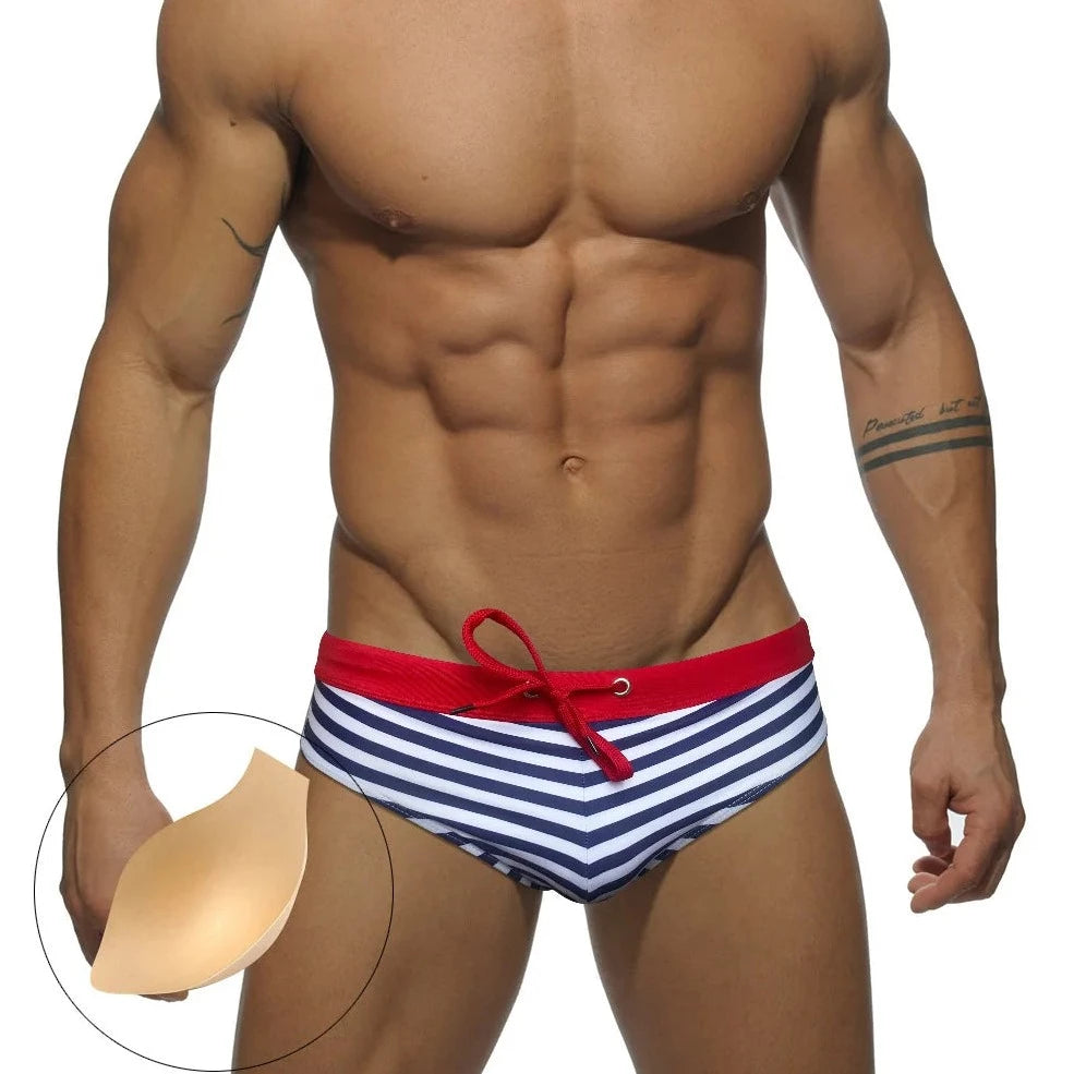 a hot gay man in blue Sailor‘s Striped Bowtie Swim Briefs - pridevoyageshop.com - gay men’s underwear and swimwear