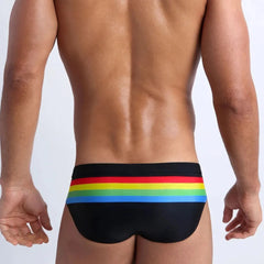 a hot gay man in black Men's Pride Ringaround Rainbow Swim Briefs - pridevoyageshop.com - gay men’s underwear and swimwear