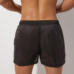 sexy gay man in black Gay Swimwear & Beachwear | Men's Transparent Swim Trunks - pridevoyageshop.com - gay men’s underwear and swimwear