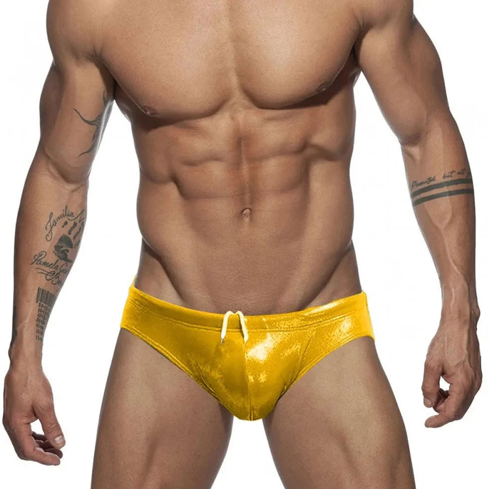 a hot gay man in yellow Glide Metallic Swim Briefs - pridevoyageshop.com - gay men’s underwear and swimwear