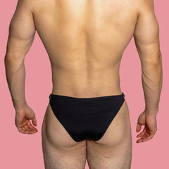 a sexy gay man in black VividFlash Leather Buckle Bikini Briefs - pridevoyageshop.com - gay men’s underwear and swimwear