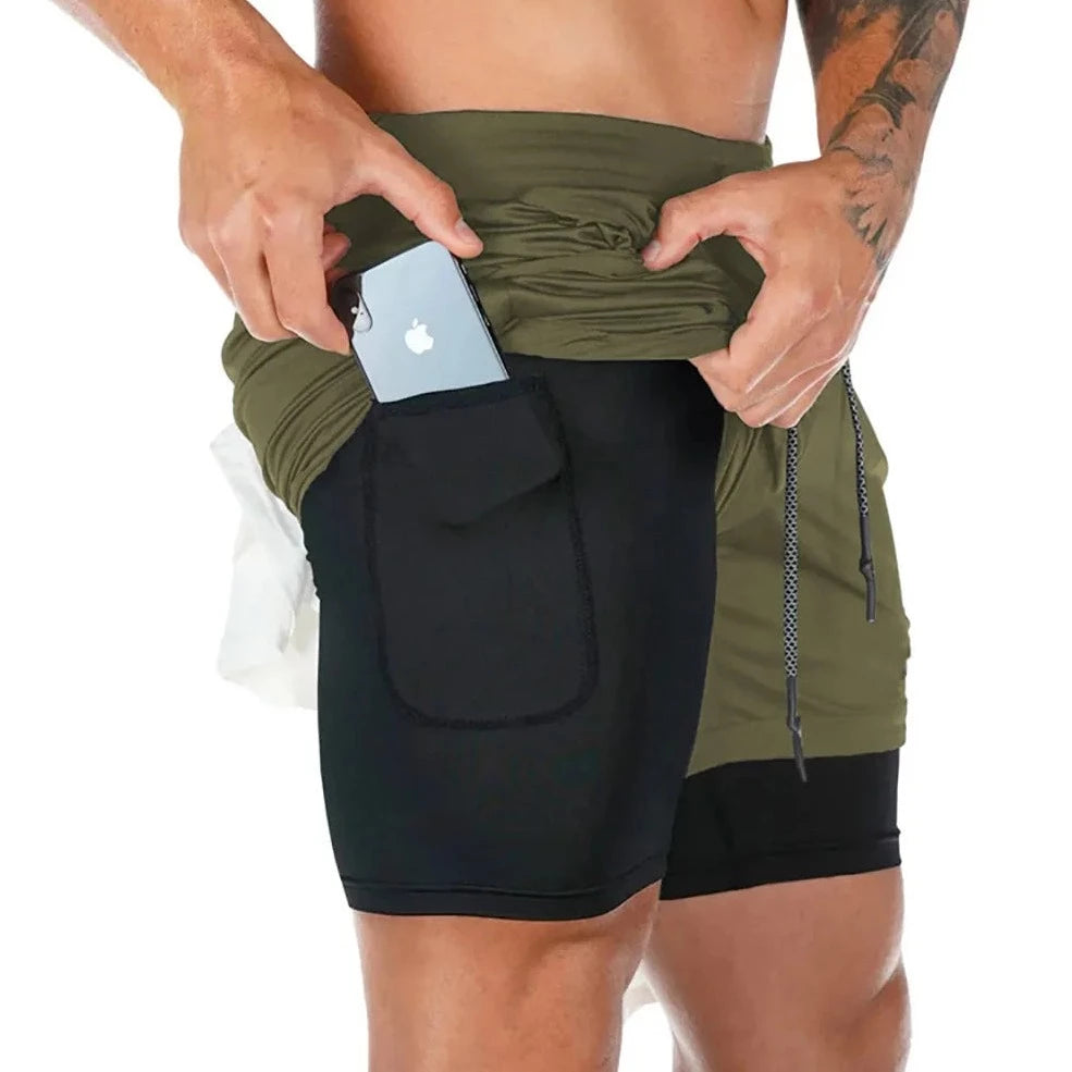 a muscle guy in army green Men's Double Layered Hidden Pocket Workout Shorts - pridevoyageshop.com - gay men’s underwear and swimwear