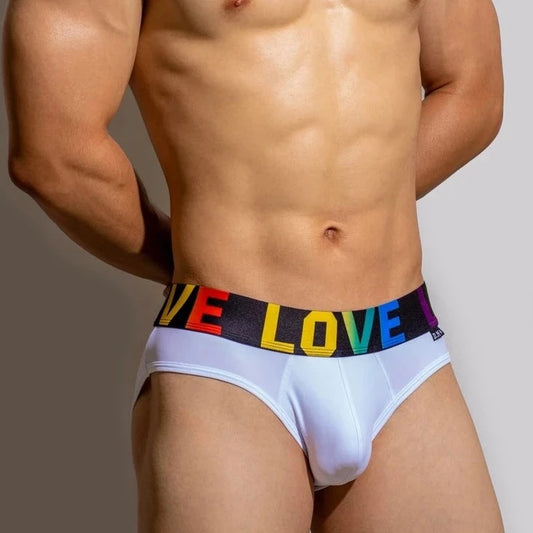 a hot gay man in white DM Rainbow Pride Love Briefs - pridevoyageshop.com - gay men’s underwear and swimwear