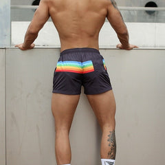 sexy gay man in black Gay Shorts | Men's Rainbow Gym Shorts - Men's Activewear, gym short, running shorts- pridevoyageshop.com