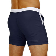 hot gay man in navy Gay Swimwear & Beachwear | Drawstring Boxer Swim Trunks - pridevoyageshop.com - gay men’s underwear and swimwear