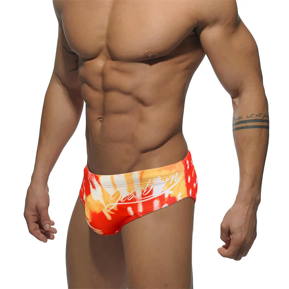 a hot gay man in Men's Fire Graffiti Swim Briefs - pridevoyageshop.com - gay men’s underwear and swimwear