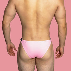 a sexy gay man in pink VividFlash Leather Buckle Bikini Briefs - pridevoyageshop.com - gay men’s underwear and swimwear