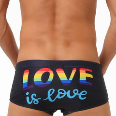 a hot gay in black Love Is Love Pride Swim Trunks - pridevoyageshop.com - gay men’s underwear and swimwear