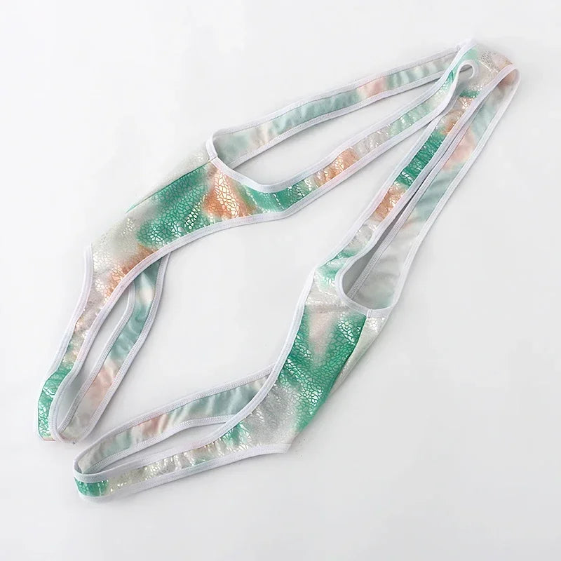 green Riot Cage Frame Singlet flat-lay showing chest cage straps and athletic singlet cut – pridevoyageshop.com – gay men’s harness, lingerie and fetish wear