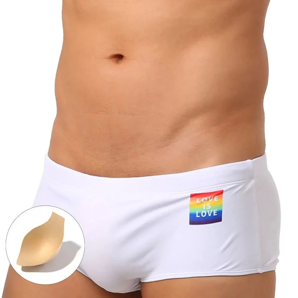 a hot gay in white Love Is Love Pride Swim Trunks - pridevoyageshop.com - gay men’s underwear and swimwear