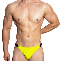 a sexy gay man in yellow VividFlash Leather Buckle Bikini Briefs - pridevoyageshop.com - gay men’s underwear and swimwear