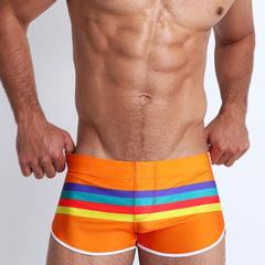 sexy gay man in orange Gay Swimwear & Beachwear | Men's Pride Stripe Swim Trunks - pridevoyageshop.com - gay men’s underwear and swimwear
