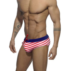 a hot gay man in red Sailor‘s Striped Bowtie Swim Briefs - pridevoyageshop.com - gay men’s underwear and swimwear
