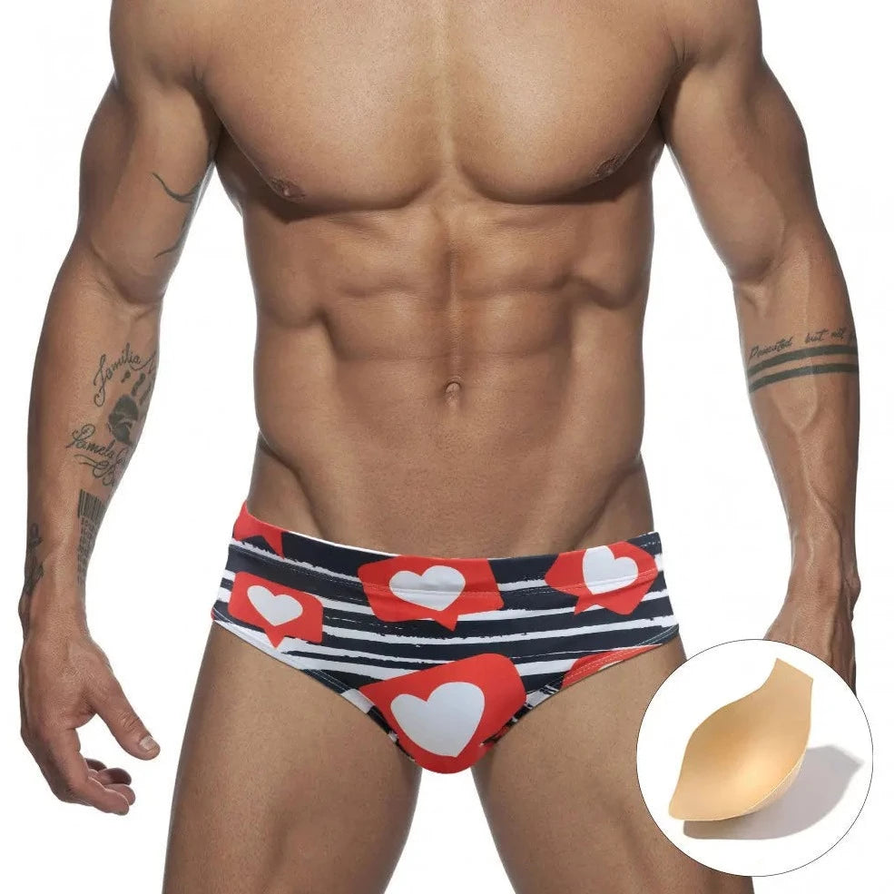 a hot gay man in Men's Heart Message Swim Briefs - pridevoyageshop.com - gay men’s underwear and swimwear