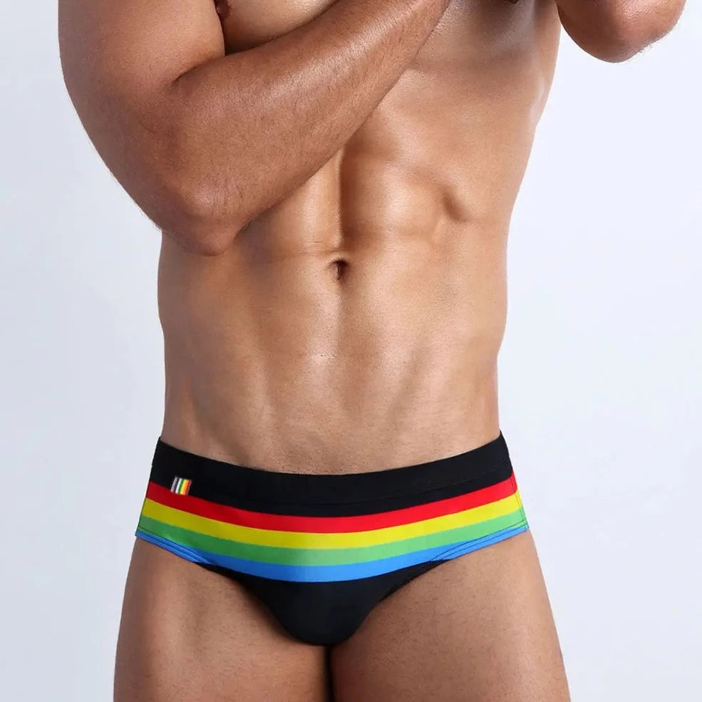 a hot gay man in black Men's Pride Ringaround Rainbow Swim Briefs - pridevoyageshop.com - gay men’s underwear and swimwear