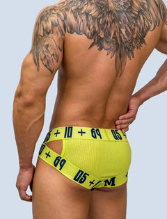 a hot gay man in yellow DM Sideshow Gay Briefs - pridevoyageshop.com - gay men’s underwear and swimwear