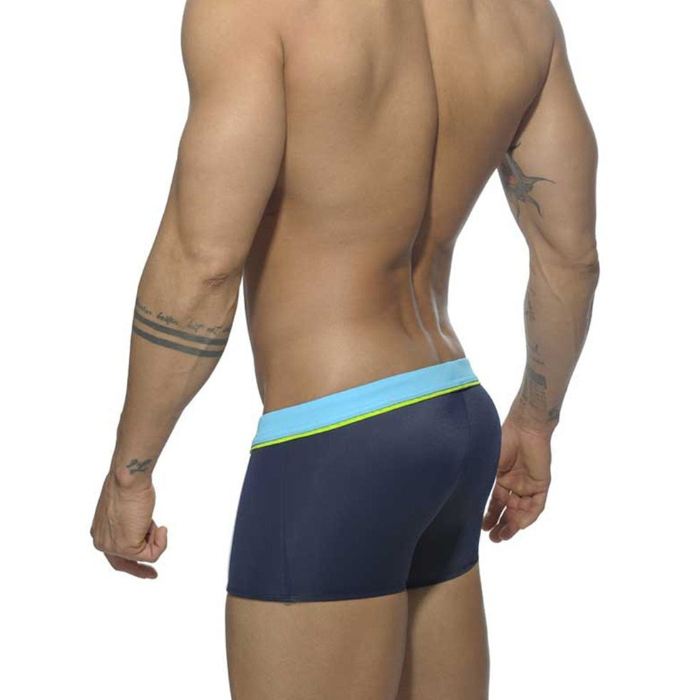 hot gay man in blue Gay Swimwear | Men's Square Cut Racing Stripe Swim Trunks - pridevoyageshop.com - gay men’s underwear and swimwear