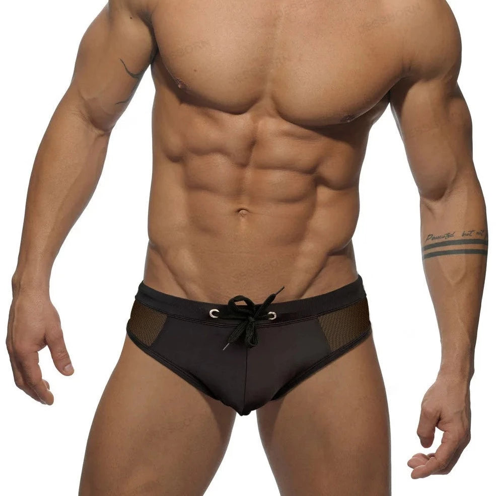 a sexy gay man in black Men's Sideshow Mesh Swim Briefs - pridevoyageshop.com - gay men’s underwear and swimwear
