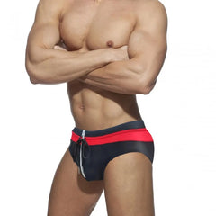 a sexy gay man in Black and Red Men's Bowtie Zippered Swim Briefs - pridevoyageshop.com - gay men’s underwear and swimwear