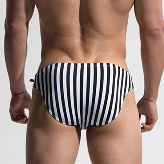 a hot gay man in Desmiit Vertical Striped Swim Briefs - pridevoyageshop.com - gay men’s underwear and swimwear