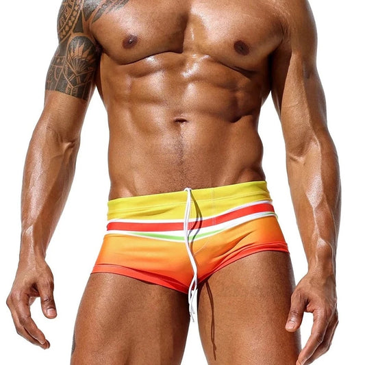 a hot gay man in Men's Sunset Horizon Swim Trunks - pridevoyageshop.com - gay men’s underwear and swimwear
