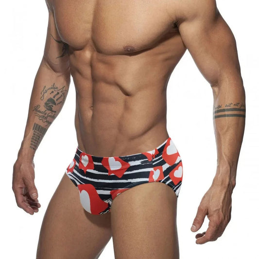 a hot gay man in Men's Heart Message Swim Briefs - pridevoyageshop.com - gay men’s underwear and swimwear