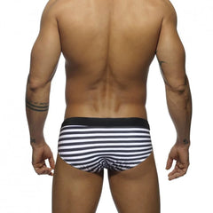 a hot gay man in black Sailor‘s Striped Bowtie Swim Briefs - pridevoyageshop.com - gay men’s underwear and swimwear