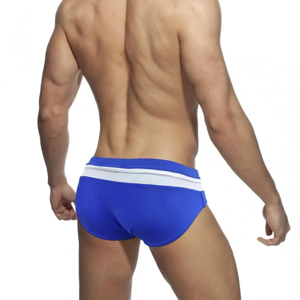 a sexy gay man in Sky Blue and White Men's Bowtie Zippered Swim Briefs - pridevoyageshop.com - gay men’s underwear and swimwear