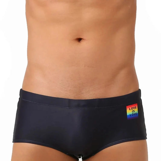 a hot gay in black Love Is Love Pride Swim Trunks - pridevoyageshop.com - gay men’s underwear and swimwear