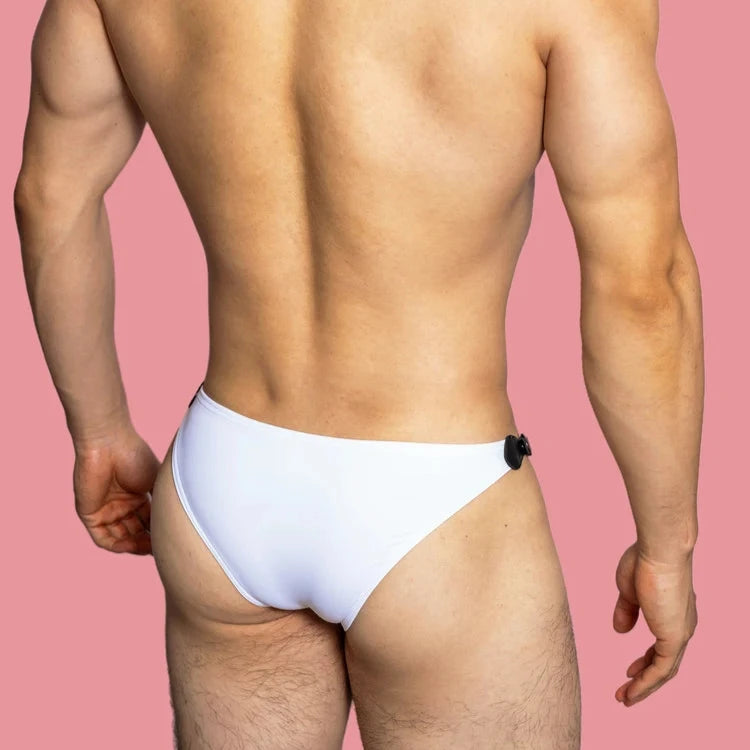 a sexy gay man in white VividFlash Leather Buckle Bikini Briefs - pridevoyageshop.com - gay men’s underwear and swimwear