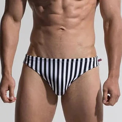 a hot gay man in Desmiit Vertical Striped Swim Briefs - pridevoyageshop.com - gay men’s underwear and swimwear