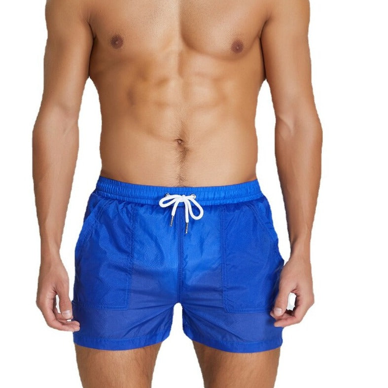 sexy gay man in blue Gay Swimwear & Beachwear | Men's Transparent Swim Trunks - pridevoyageshop.com - gay men’s underwear and swimwear