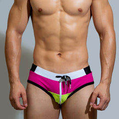sexy gay man in rose red Gay Swimwear | DM Laced Swim Briefs- pridevoyageshop.com - gay men’s underwear and swimwear