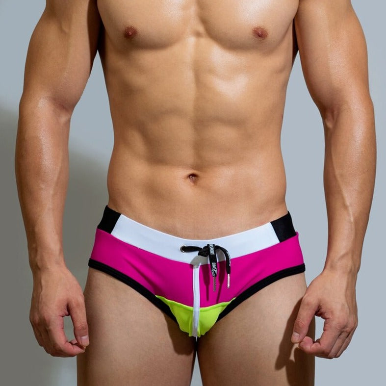sexy gay man in rose red Gay Swimwear | DM Laced Swim Briefs- pridevoyageshop.com - gay men’s underwear and swimwear