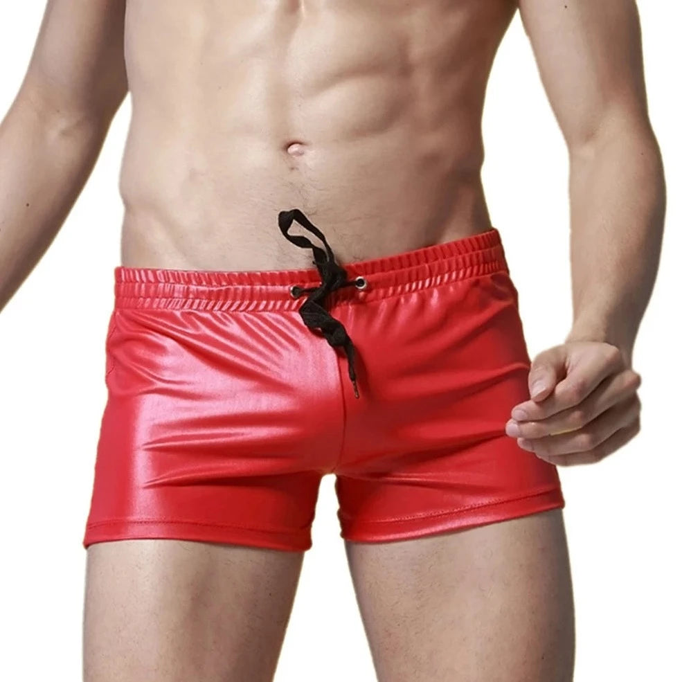a sexy gay man in red Solid Color Faux Leather Swim Trunks - pridevoyageshop.com - gay men’s underwear and swimwear
