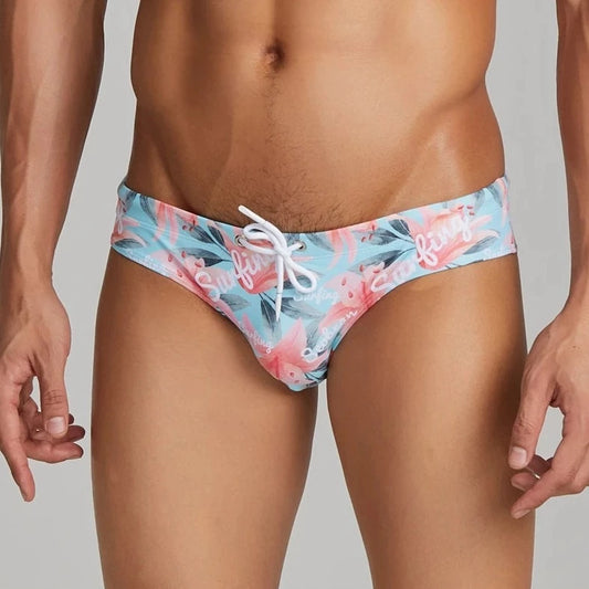 a hot gay man in light blue Men's Floral Bikini Swim Briefs - pridevoyageshop.com - gay men’s underwear and swimwear