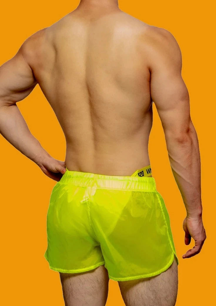 a hot gay man in Fluorescent Green Men's See-Thru Strap Shorts - Men's Activewear, gym short, sport shorts, running shorts- pridevoyageshop.com