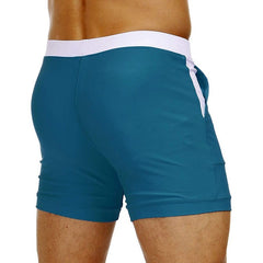 hot gay man in Peacock Blue Gay Swimwear & Beachwear | Drawstring Boxer Swim Trunks - pridevoyageshop.com - gay men’s underwear and swimwear