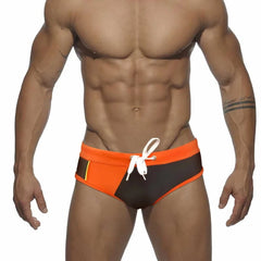 a sexy gay man in orange Men's Patchwork Bowtie Swim Briefs - pridevoyageshop.com - gay men’s underwear and swimwear