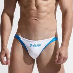 a sexy gay man in white DESMIIT Men's D-Surf Swim Briefs - pridevoyageshop.com - gay men’s underwear and swimwear
