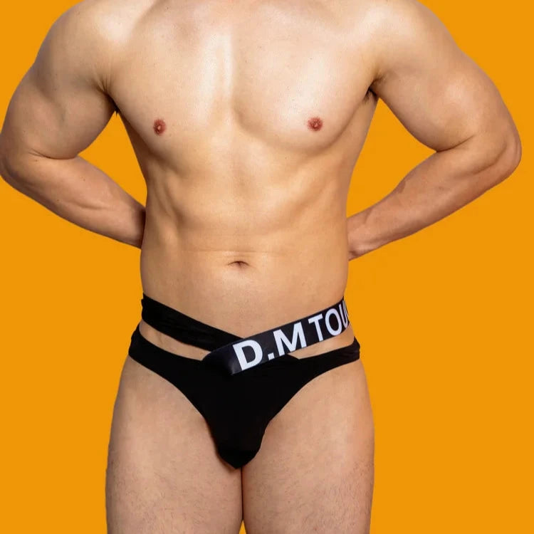 a hot man in black DM Touch Me Strap Thong - pridevoyageshop.com - gay men’s thongs, boxers, briefs and jockstraps