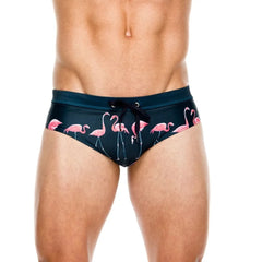 a hot gay man in dark blue Men's Flamingo Swim Briefs - pridevoyageshop.com - gay men’s underwear and swimwear