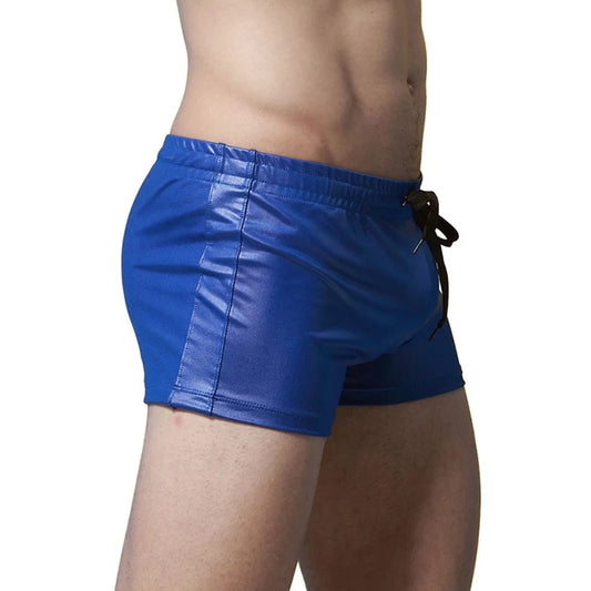 a sexy gay man in blue Solid Color Faux Leather Swim Trunks - pridevoyageshop.com - gay men’s underwear and swimwear