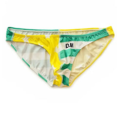 a hot gay man in Yellow Green DESMIIT Stars + Stripes Ultra Low Rise Swim Briefs - pridevoyageshop.com - gay men’s underwear and swimwear