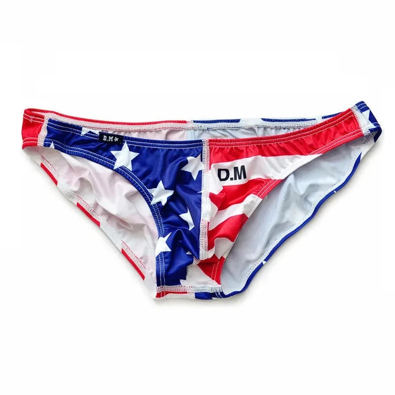 a hot gay man in Red + White + Blue DESMIIT Stars + Stripes Ultra Low Rise Swim Briefs - pridevoyageshop.com - gay men’s underwear and swimwear