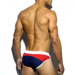 a hot gay man in dark blue Men's Two-toned Bold Swim Briefs - pridevoyageshop.com - gay men’s underwear and swimwear
