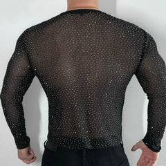 Twinkle Twunk Mesh Long Sleeve Black color sheer sparkle mesh long sleeve top worn by a muscular gay man posing in studio lighting pridevoyageshopcom gay mens gym tank tops mesh tank tops clubwear fashion tops and activewear