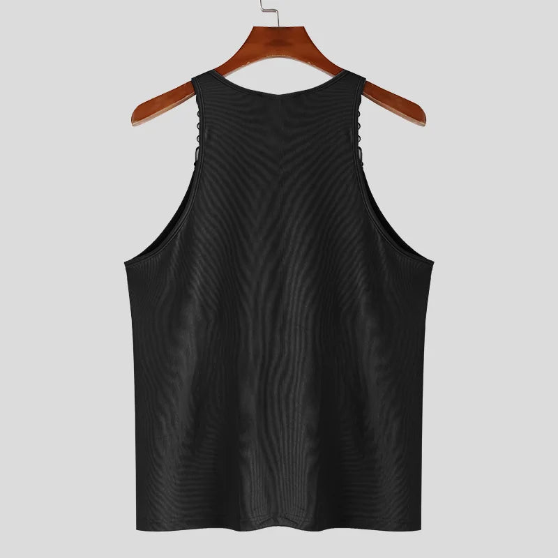 a flat lay of Black Pull Me Closer Chain Strap Tank - pridevoyageshop.com - gay men's fashion, clubwear, party outfit
