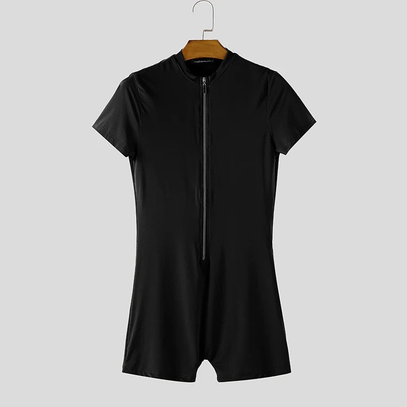 a flat lay of Black Ramrod V‑Zip Bodysuit - pridevoyageshop.com - gay men's lingerie, bodywear, fetish wear
